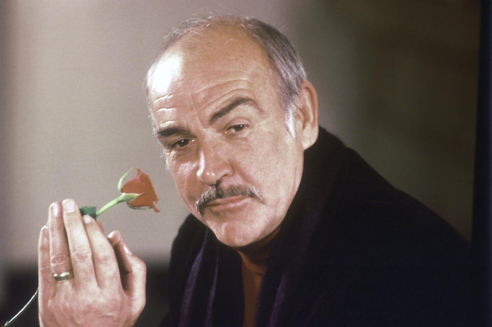 FILE - In this Jan. 23, 1987 file photo, actor Sean Connery holds a rose in his hand as he talks about his new movie "The Name of the Rose" at a news conference in London. Scottish actor Sean Connery, considered by many to have been the best James Bond, has died aged 90, according to an announcement from his family. (AP Photo/Gerald Penny, File)