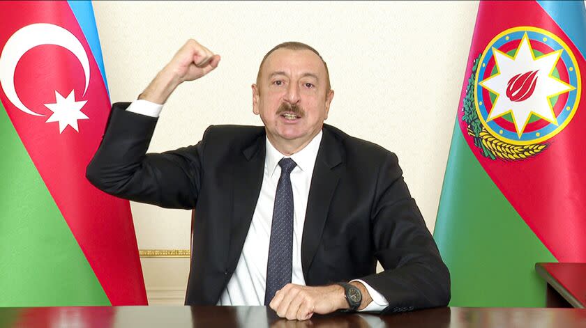 In this photo provided on Wednesday, Nov. 25, 2020, by the Azerbaijan's Presidential Press Office, Azerbaijani President Ilham Aliyev gestures as he addresses the nation in Baku, Azerbaijan. The Azerbaijani army has entered the Kalbajar region, one more territory ceded by Armenian forces in a truce that ended deadly fighting over the separatist territory of Nagorno-Karabakh. (Azerbaijani Presidential Press Office via AP)