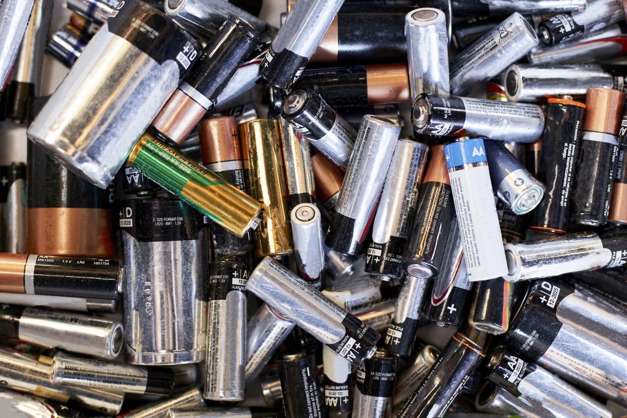 High angle view of piles of used batteries ready for recycling