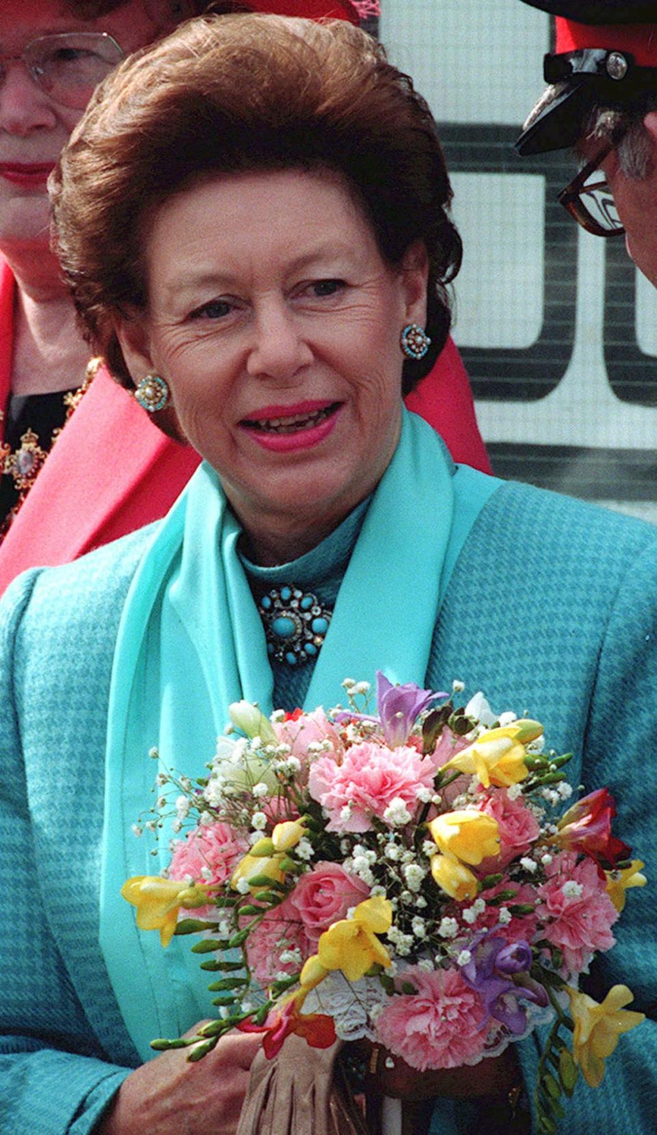 <div class="inline-image__caption"><p>Britain's Princess Margaret smiles as she leaves a youth centre in Manchester in April 1994.</p></div> <div class="inline-image__credit">REUTERS/Russell Boyce</div>
