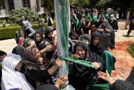 Afghan Shiite Muslim attend a mourning ceremony three days ahead of Ashoura to mark Ashoura, in a mosque in Kabul, Afghanistan, Friday, Aug. 5, 2022. Ashoura falls on the 10th day of Muharram, the first month of the Islamic calendar, when Shiites mark the death of Hussein, the grandson of the Prophet Muhammad, at the Battle of Karbala in present-day Iraq in the 7th century. (AP Photo/Ebrahim Noroozi)