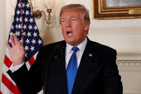 FILE PHOTO: U.S. President Donald Trump speaks about the Iran nuclear deal in the Diplomatic Room of the White House in Washington, October 13, 2017. REUTERS/Kevin Lamarque/File Photo