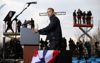 <p>President Barack Obama addresses a rally during the last day of campaigning in the general election November 5, 2012 in Madison, Wisconsin. Obama and his opponent, Republican presidential nominee and former Massachusetts Gov. Mitt Romney are stumping from one ‘swing state’ to the next in a last-minute rush to persuade undecided voters. (Chip Somodevilla/Getty Images) </p>