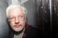 WikiLeaks' founder Julian Assange leaves Westminster Magistrates Court in London