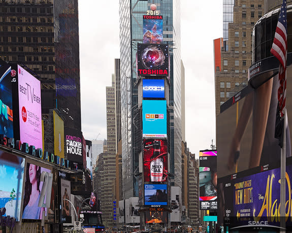 The Toshiba Vision screen in Times Square is showing pictures taken of and by the Hubble Space Telescope every few minutes through April 26. In this image, the lower screen shows V838 Monocerotis.