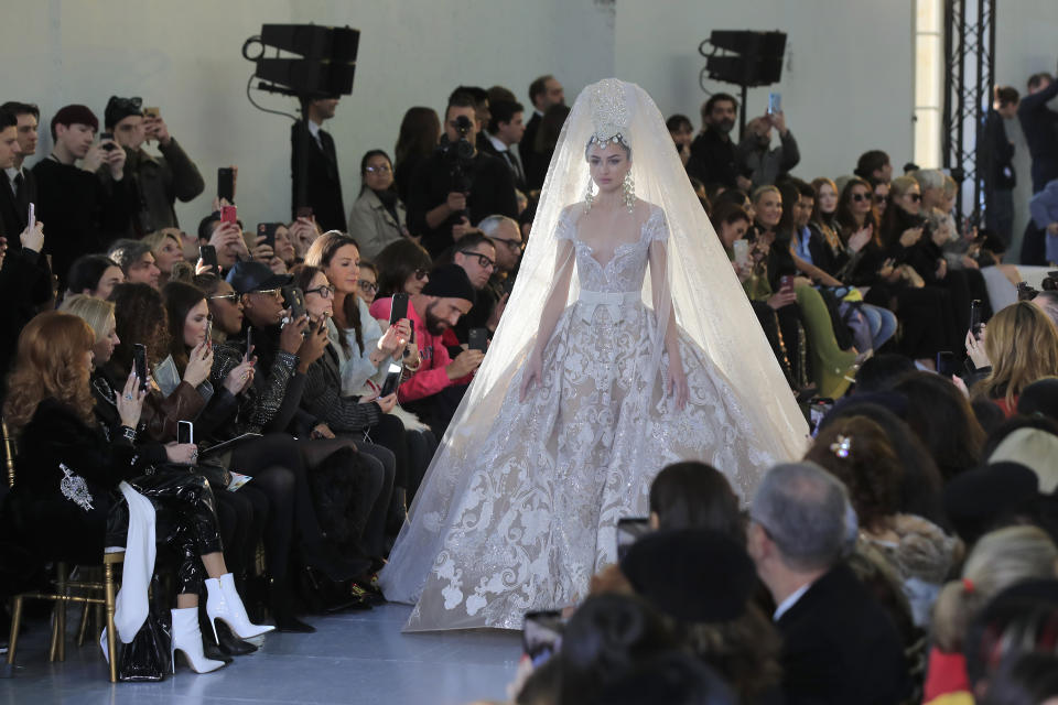 A model wears a creation for the Elie Saab Haute Couture Spring/Summer 2020 fashion collection presented Wednesday Jan. 22, 2020 in Paris. (AP Photo/Michel Euler)