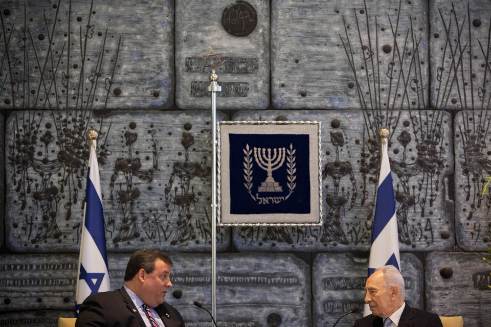 New Jersey Gov. Chris Christie, left, speaks with Israeli President Shimon Peres during their meeting at the President's residence in Jerusalem, Tuesday, April. 3, 2012. Christie kicked off his first official overseas trip Monday meeting Israel's leader in a visit that may boost the rising Republican star's foreign policy credentials ahead of November's presidential election.(AP Photo/Oded Balilty)