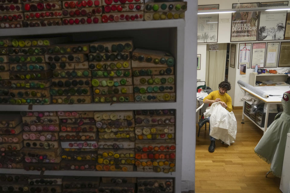 A dressmaker works at the Tirelli Atelier in Rome, Tuesday, March 5, 2024. For nearly six decades, the Tirelli atelier in Rome has woven itself into the fabric of Italian and international film history, earning the nickname the "Oscar tailor's shop" for its contribution to cinematic costume design. Established in November 1964, the shop on a quiet Roman street has been behind 17 Academy Awards for Best Costume Design. (AP Photo/Gregorio Borgia)