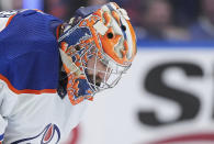 Edmonton Oilers goalie Stuart Skinner looks down during a stoppage in play during the third period of Game 1 of the team's second-round NHL hockey Stanley Cup playoffs series against the Vancouver Canucks, Wednesday, May 8, 2024, in Vancouver, British Columbia. (Darryl Dyck/The Canadian Press via AP)
