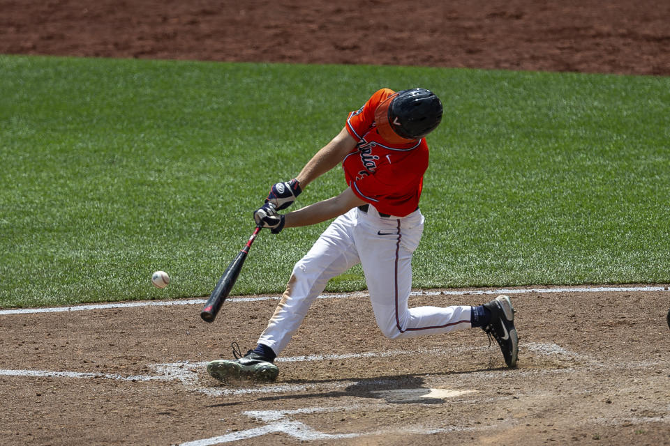 Virginia's Kyle Teel (3) singles in the seventh inning and advanced Max Cotier to third against Tennessee during a baseball game in the College World Series, Sunday, June 20, 2021, at TD Ameritrade Park in Omaha, Neb. (AP Photo/John Peterson)