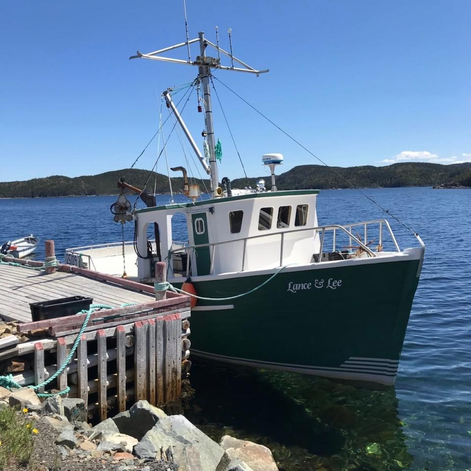 Lee Croucher was on board his boat getting ready for the day when he decided to fetch a stray soccer ball on the beach for his kids to play with.