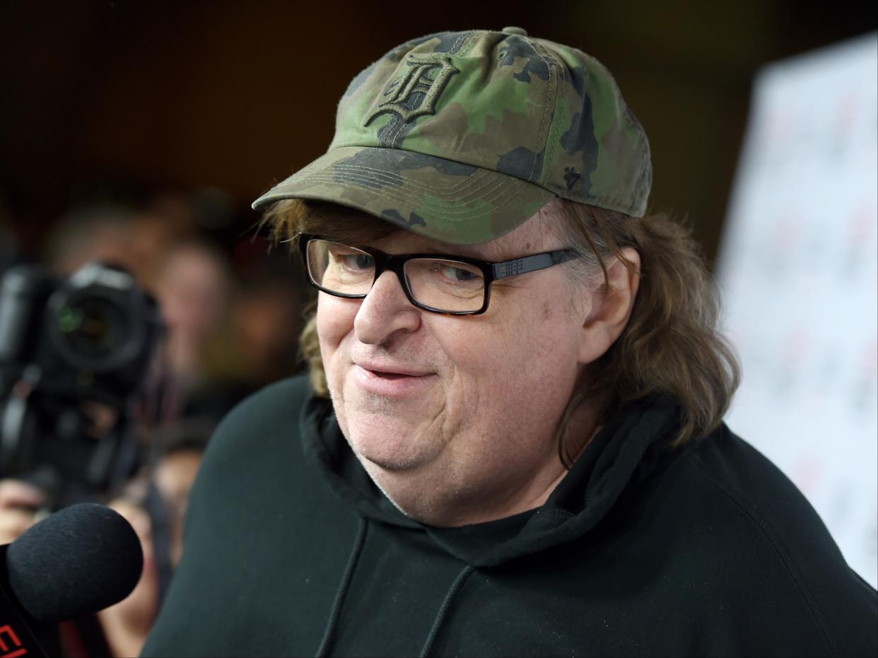 Documentarian Michael Moore suggests Donald Trump may be faking his coronavirus diagnosis to garner sympathy before the election.  Trump political advisor Hope Hicks, as well as another White House staffer and two reporters working in the White House also have tested positive since Mr Trump was diagnosed. (Getty Images North America)