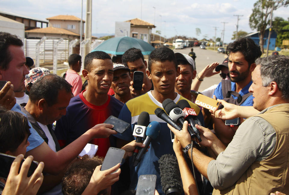 Defected Venezuelan National Guard Sergeants Jean Carlos Cesar Parra, right, and Jorge Luis Gonzalez Romero talk to the press in Pacaraima, Brazil, Sunday, Feb. 24, 2019 during a confrontation over aid shipments for Venezuela after its government closed its borders with Brazil and Colombia. There's been little suggestion any battalion or division commanders are willing to defect despite almost daily calls by Venezuelan opposition leader Juan Guaido and the U.S. (AP Photo/Edmar Barros)