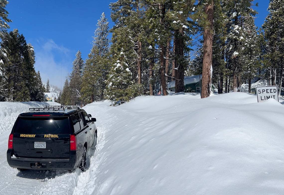 A CHP cruiser approaches Shaver Lake, California, in eastern Fresno County in a photo posted to social media on Wednesday, March 1, 2023. Shaver Lake has been shut off to traffic since Highway 168 was closed Friday, Feb. 24, 2023, due to snow and ice conditions.