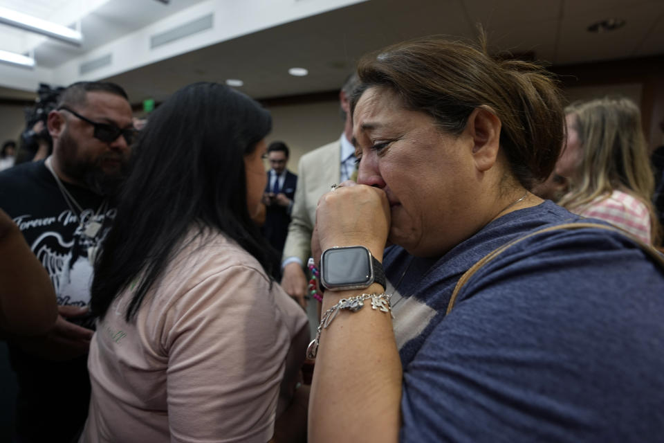 Veronica Mata, right, and other family members of the victims of the Uvalde shootings react after a Texas House committee voted to take up a bill to limit the age for purchasing AR-15 style weapons in the full House in Austin, Texas, Monday, May 8, 2023. (AP Photo/Eric Gay)