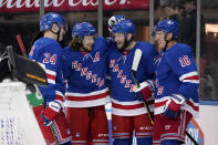 New York Rangers defenseman Anthony Bitetto (22), third from left, celebrates his goal with right wing Kaapo Kakko (24), left wing Artemi Panarin (10) and center Ryan Strome (16) during the second period of a preseason NHL hockey game against the Boston Bruins, Tuesday, Sept. 28, 2021, at Madison Square Garden in New York. (AP Photo/Corey Sipkin).