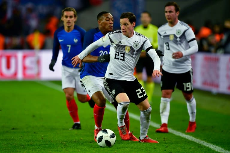 Germany's midfielder Sebastian Rudy (R) and France's forward Anthony Martial vie for the ball during the international friendly football match November 14, 2017