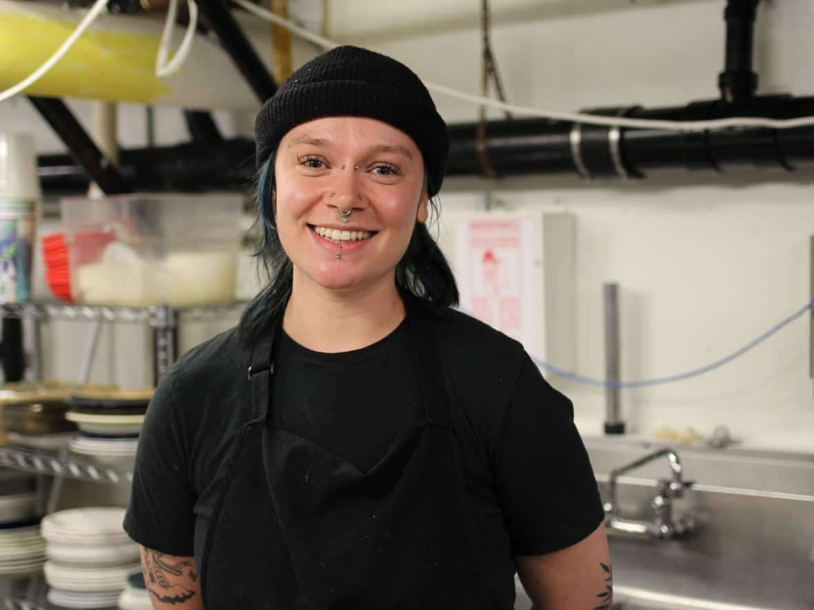 Maddy Vine says her current employer, Calgary restaurant D.O.P., and her previous one, Sidewalk Citizen, have offered benefits — something that still isn't common across the industry. (Paula Duhatschek/CBC - image credit)