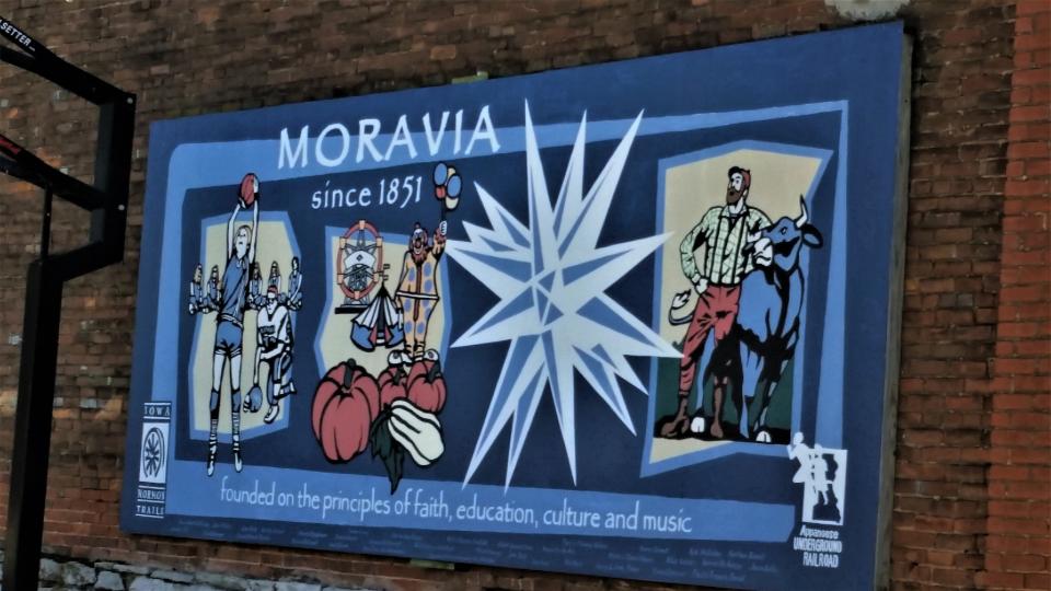 A mural in Moravia contains an image of Molly (Van Benthuysen) Bowlin as a prep.