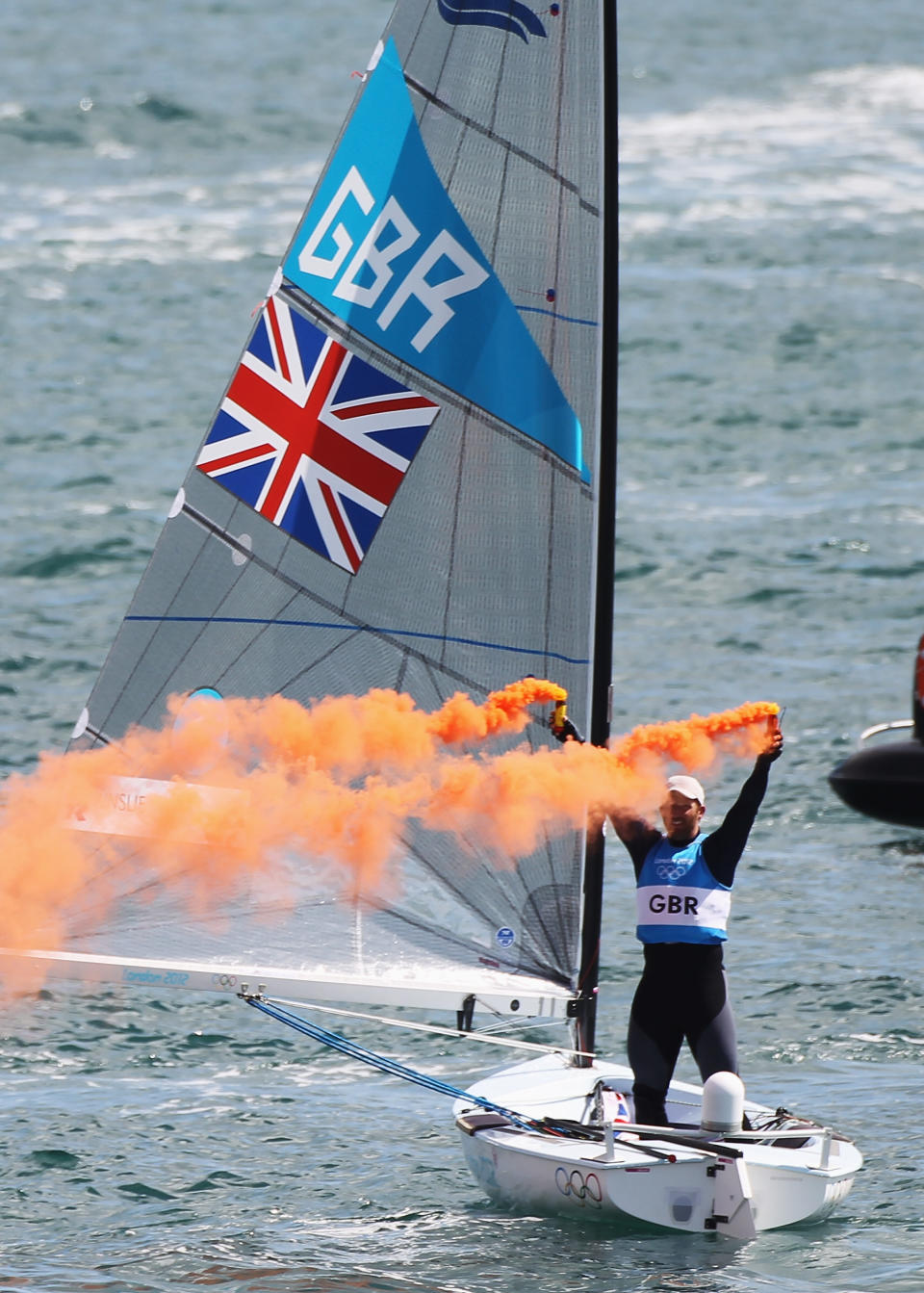 WEYMOUTH, ENGLAND - AUGUST 05: Ben Ainslie of Great Britain celebrates overall victory after competing in the Men's Finn Sailing Medal Race on Day 9 of the London 2012 Olympic Games at the Weymouth & Portland Venue at Weymouth Harbour on August 5, 2012 in Weymouth, England. (Photo by Getty Images)