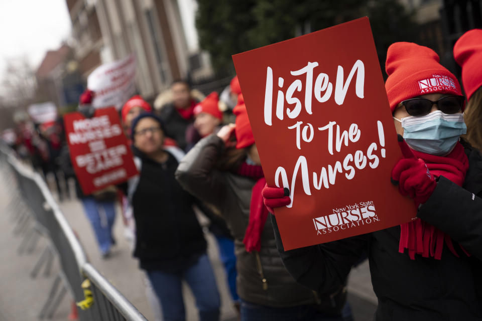 Protestors march on the streets around Montefiore Medical Center during a nursing strike, Wednesday, Jan. 11, 2023, in the Bronx borough of New York. Two New York City hospitals have reached a tentative contract agreement with thousands of striking nurses that ends the walkout, the nurses' union announced Thursday, Jan. 12, 2023. (AP Photo/John Minchillo, File)