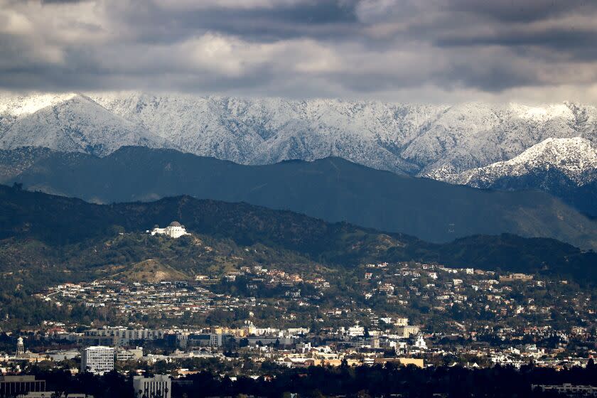 LOS ANGELES CALIF. - FEB. 26, 2023. Clouds partially obscure mountains covered in snow north of Los Angeles on Sunday, Feb. 26, 2023. More rain and snow is forecast for Southern California as a another storm front passes through the region in coming days. (Luis Sinco / Los Angeles Times)