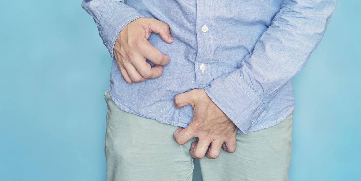 man scratch the itch with hand, penis, itching, concept with healthcare and medicine urinary incontinence itching in the groin