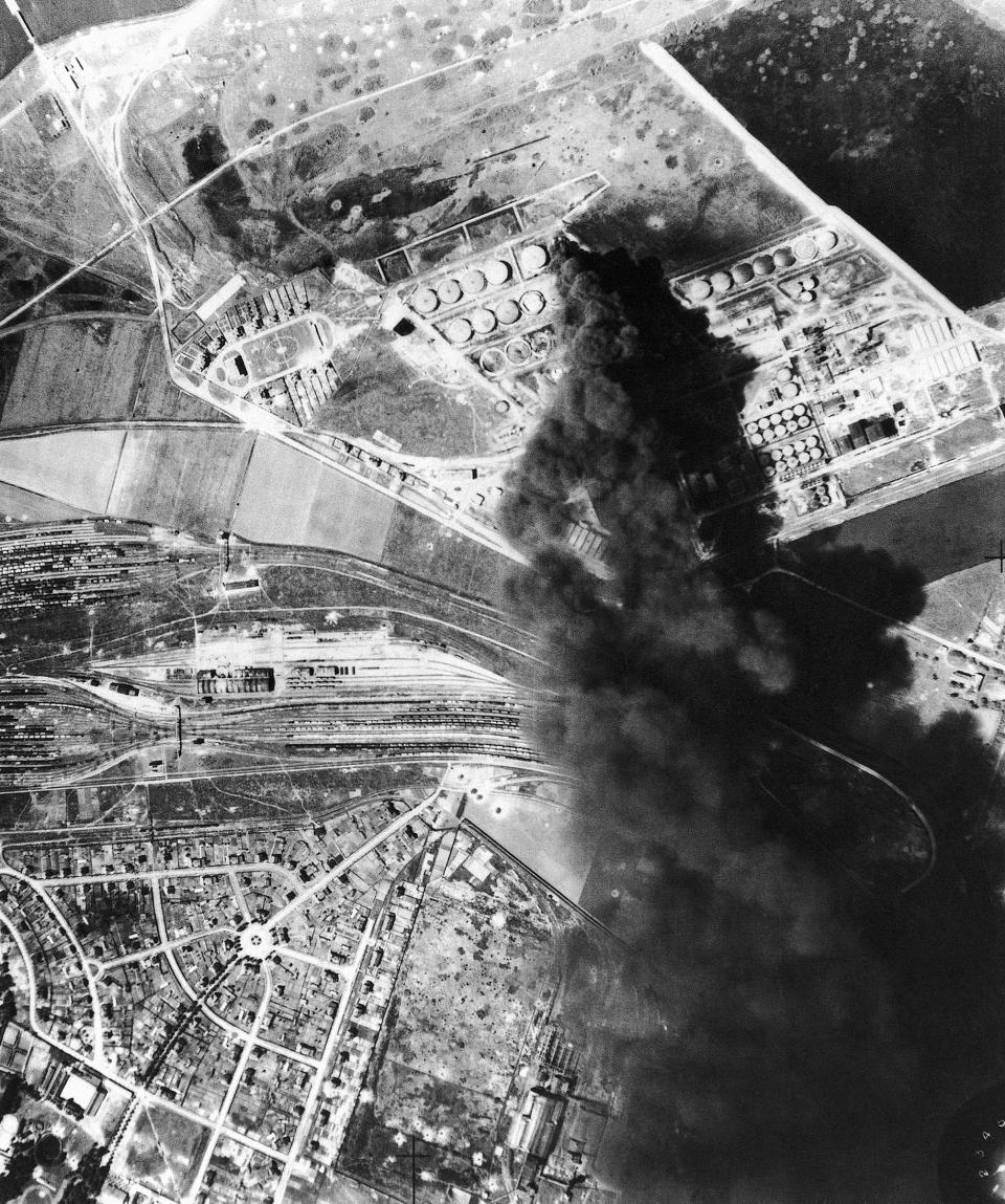 A dense smoke rising several thousand feet marks a burning oil tank destroyed by the Royal Air Force at Dunkirk, France, on June 5, 1940.