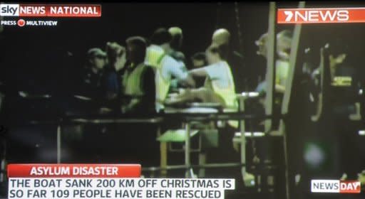 This screen grab of Channel Seven footage shown on Sky News and taken on June 22 shows survivors arriving at Christmas Island after their boat capsized 120 nautical miles north of Christmas Island on June 21. So far 109 people have been rescued from the vessel