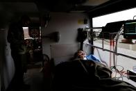 Ukrainian volunteer medics use a converted bus to transport wounded Ukrainian soldiers from the eastern frontline near Bakhmut to a hospital in Dnipro