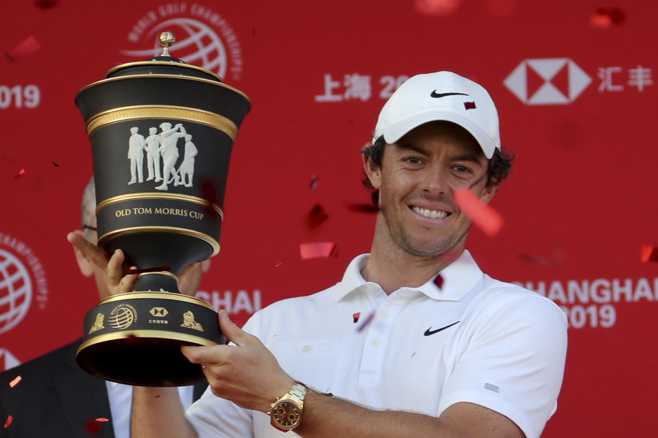 Rory McIlroy of Northern Ireland raises the trophy after winning the HSBC Champions golf tournament at the Sheshan International Golf Club in Shanghai on Sunday, Nov. 3, 2019. (AP Photo/Ng Han Guan)