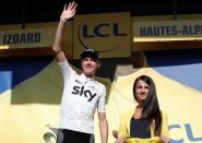 Cycling - The 104th Tour de France cycling race - The 179.5-km Stage 18 from Briancon to Izoard, France - July 20, 2017 - Team Sky rider Chris Froome of Britain celebrates on the podium, before receiving the overall leader's yellow jersey. REUTERS/Benoit Tessier