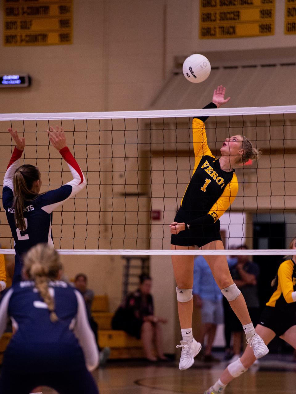 Bishop Verot's Kerrigan Habing foes up for the kill as the Vikings hosted Estero in volleyball match on Tuesday, Sept. 5. The Vikings won in three close sets on what was billed at Neon Night.