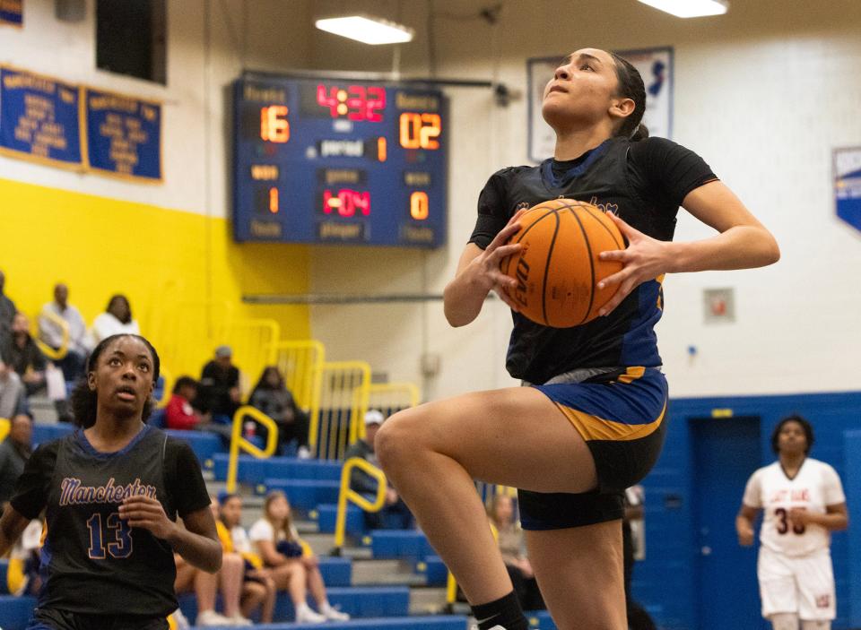 Devyn Quigley drives to the basket for two points. Manchester Girls Basketball advances in state tournament play against Overbrook as Devyn Quigley surpassed the all-time scoring record on the Shore. against