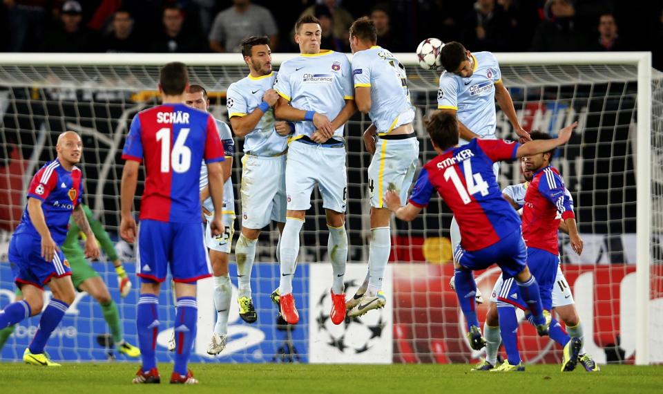 FC Basel players attempt to score during the Champions League Group E soccer match against Steaua Bucharest at St. Jakob-Park in Basel November 6, 2013. REUTERS/Arnd Wiegmann (SWITZERLAND - Tags: SPORT SOCCER)