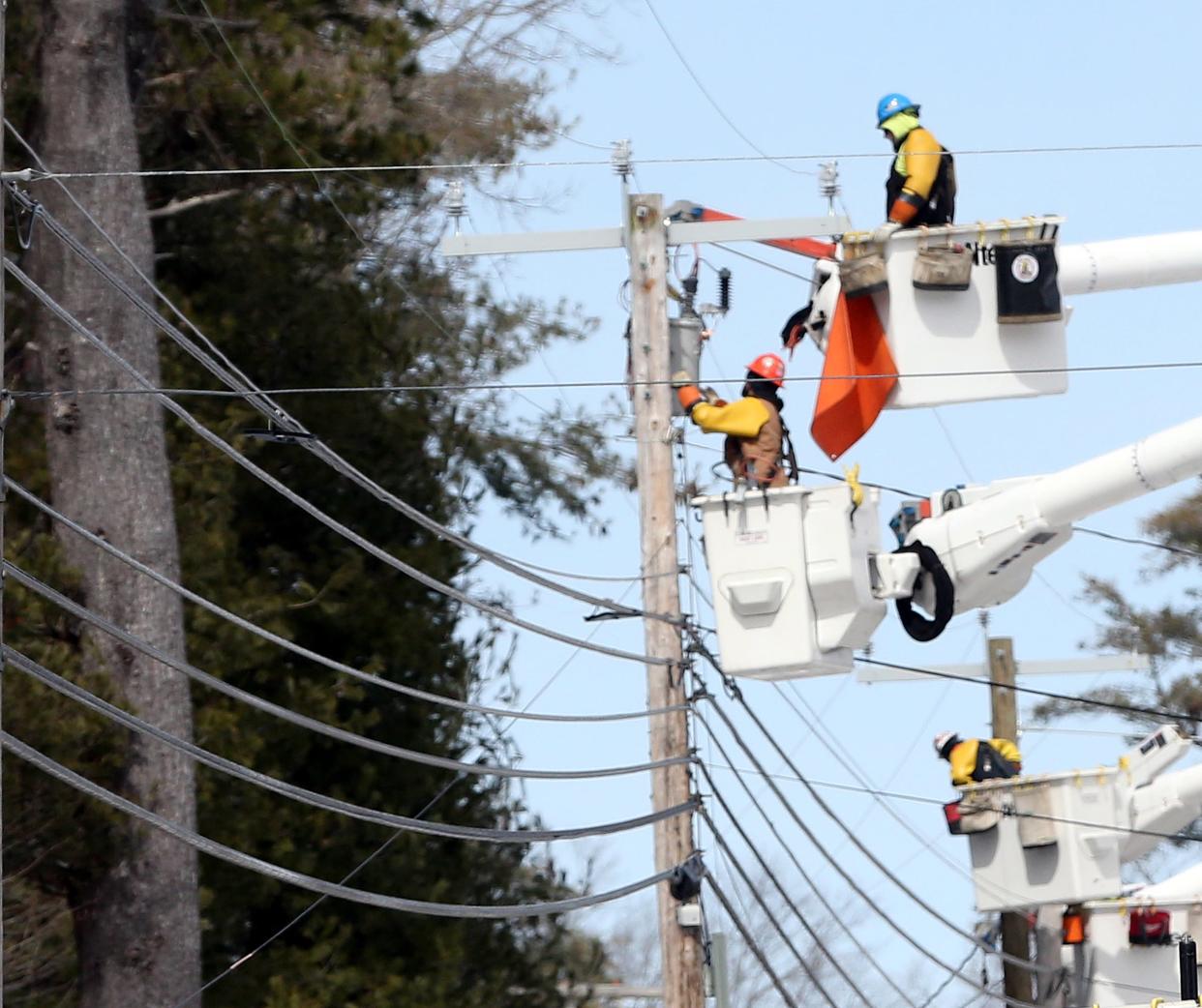 Line crews remained busy on Twombley Road in Sanford Monday, March 25, 2024, as they try to restore power to residents following an ice storm on Saturday.