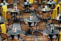 FILE PHOTO: Restaurant seats stand empty in Covent Garden in London, Britain