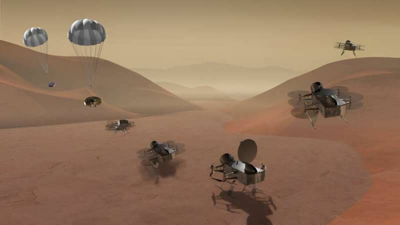 Fragmentaryczna ilustracja łazika Dragonfly lądującego na powierzchni Tytana, rozkładającego swoje wirniki i ponownie startującego w celu obserwacji krajobrazu i atmosfery. 