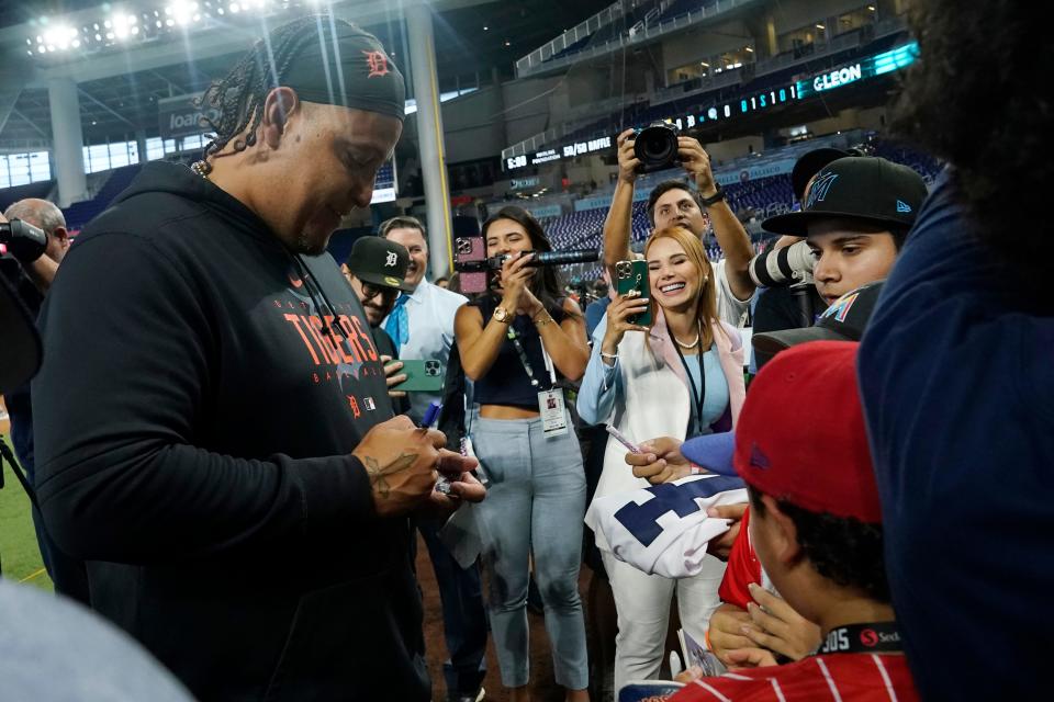 Detroit Tigers' Miguel Cabrera, left, gives autographs before a baseball game against the Miami Marlins at loanDepot Park in Miami on Friday, July 28, 2023.