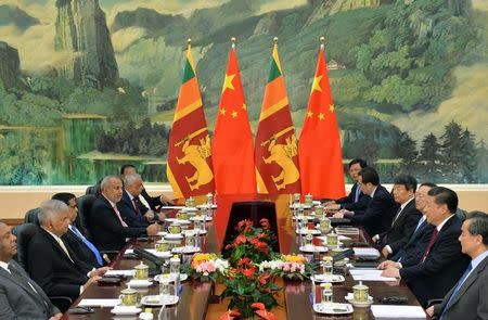 Sri Lankan Prime Minister Ranil Wickremesinghe (2nd L) attends a meeting with Chinese President Xi Jinping (2nd R) at Great Hall of the People in Beijing, China, April 8, 2016. REUTERS/Kenzaburo Fukuhara/Pool