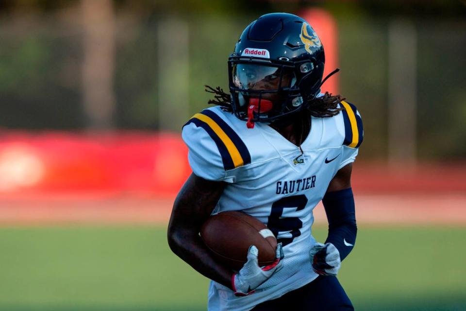 Gautier’s Caylen Edwards runs the ball down the field during a Jamboree game at Biloxi High School on Friday, Aug. 18, 2023.