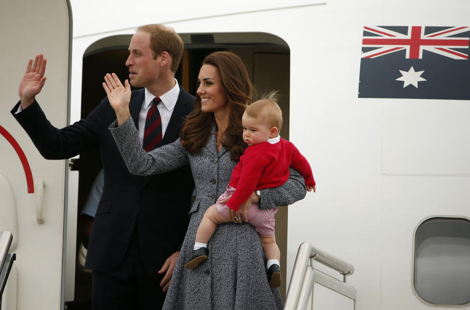 Britain's Catherine, the Duchess of Cambridge, waves with her husband Prince William, as she holds her son Prince George before they depart Canberra April 25, 2014. The Prince and his wife Kate are undertaking a 19-day official visit to New Zealand and Australia with their son Prince George.   REUTERS/Phil Noble  (AUSTRALIA - Tags: ROYALS ENTERTAINMENT POLITICS TPX IMAGES OF THE DAY)