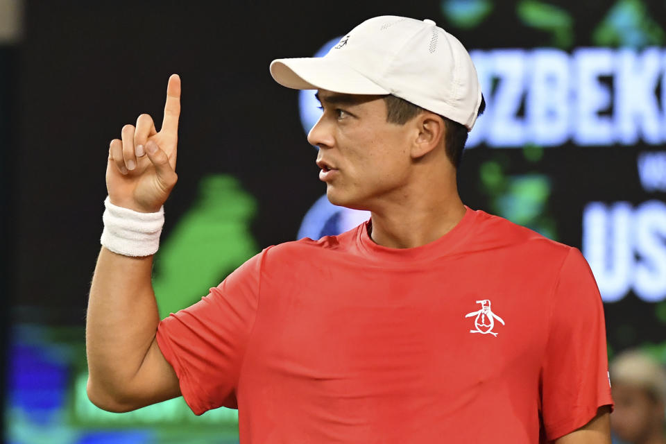 Mackenzie McDonald of the USA reacts during a singles Davis Cup qualifier tennis match between Uzbekistan and the USA against Sergey Fomin of Uzbekistan in Tashkent, Uzbekistan, Friday, Feb. 3, 2023. (AP Photo)