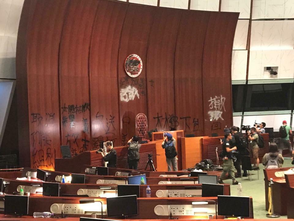 Damage to the Legislative Council following a break-in by protesters is seen during a media tour, Wednesday, July 3, 2019, in Hong Kong. (AP Photo/Johnson Lai)