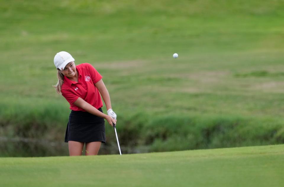 Seabreeze's Amelia Cobb chips onto the No. 9 green during the Five Star Conference Championship at The Golf Club at Venetian Bay, Monday, Oct. 9, 2023.