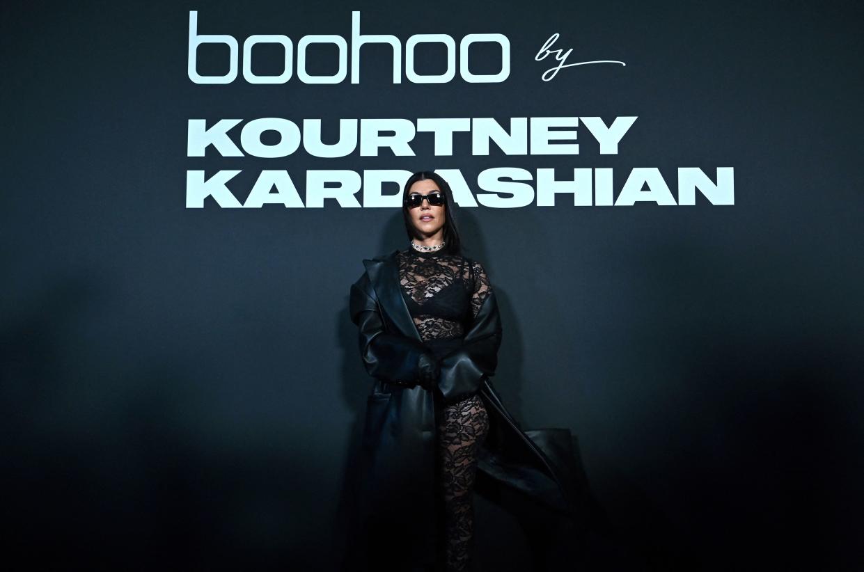 Kourtney Kardashian poses on the runway at the Boohoo by Kourtney Kardashian show during New York Fashion Week on September 13, 2022 in New York city. (Photo by ANGELA WEISS / AFP) (Photo by ANGELA WEISS/AFP via Getty Images)