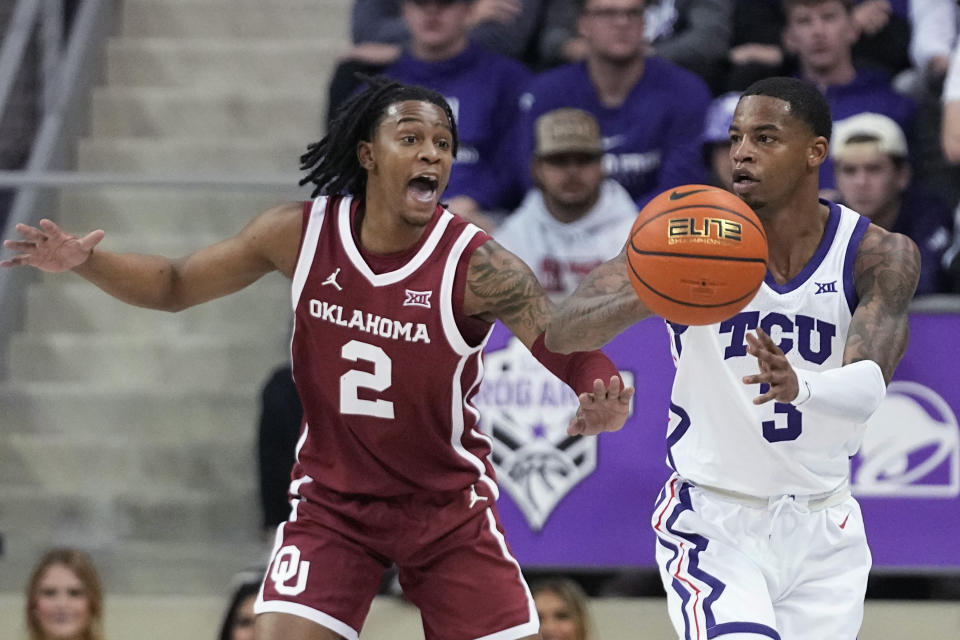 TCU guard Avery Anderson III (3) passes the ball away from Oklahoma guard Javian McCollum (2) during the first half of an NCAA college basketball game in Fort Worth, Texas, Wednesday, Jan. 10, 2024. (AP Photo/LM Otero)