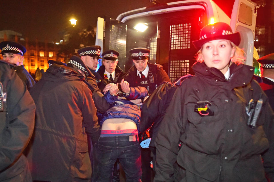 A pro Brexit demonstrator is arrested outside the Houses of Parliament in London. (Photo by David Mirzoeff/PA Images via Getty Images)