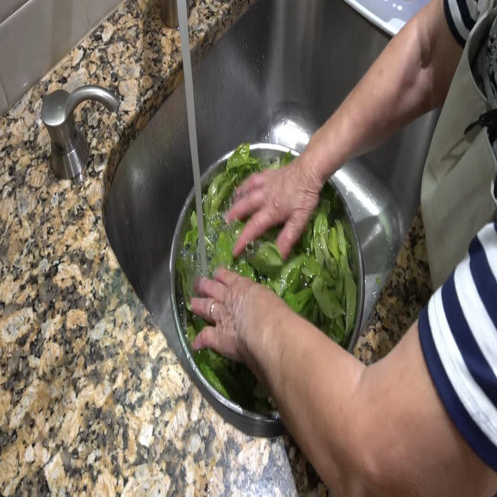 italian grandmother making pesto at home