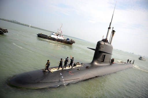 A French-made Malaysian submarine it reaches its naval base in Port Klang on the outskirts of Kuala Lumpur in 2009. A scandal linking Malaysia's leader, a young woman's murder and alleged kickbacks in a French submarine deal has resurfaced as a potential danger for the government as elections loom